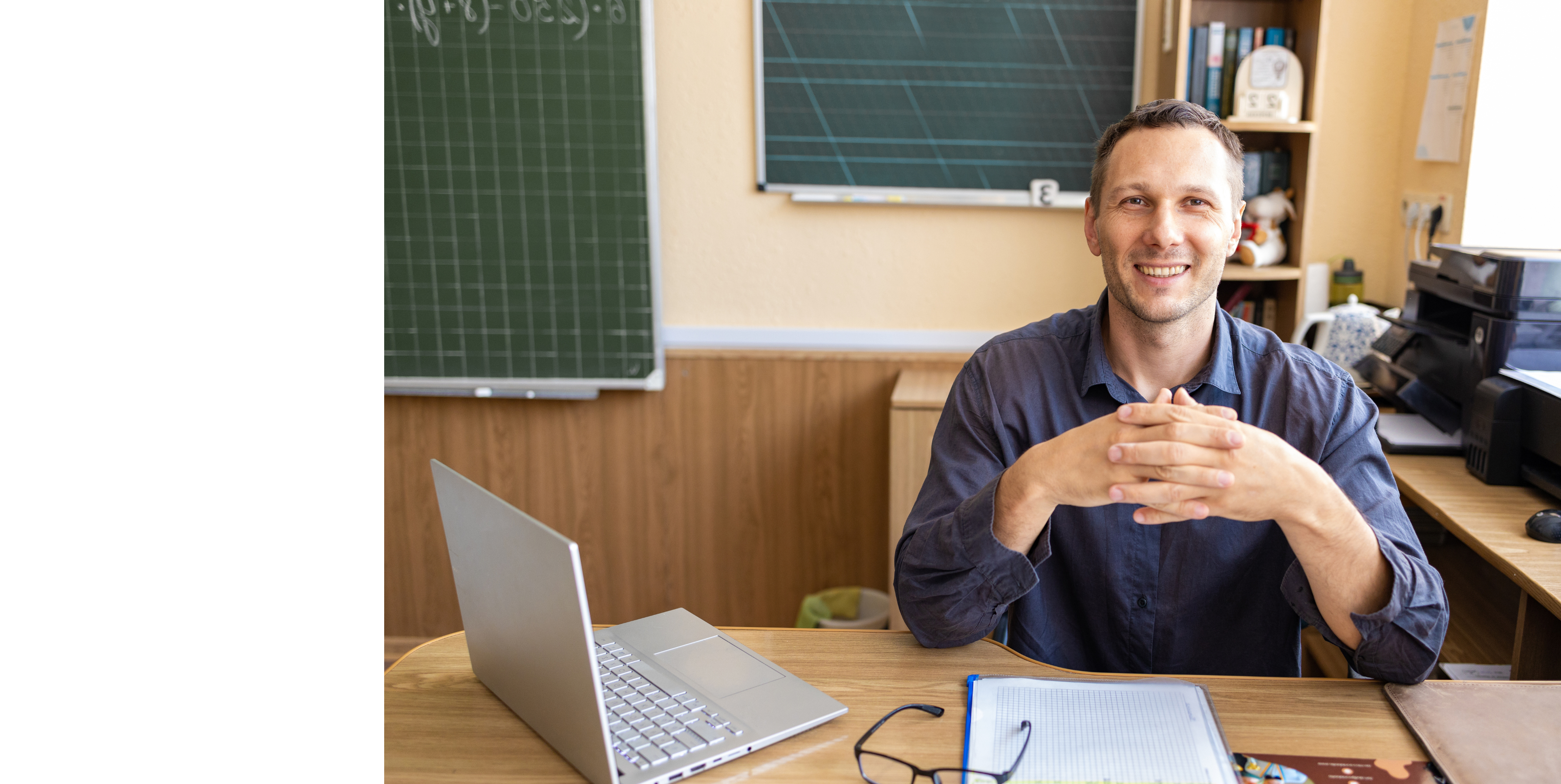 Teacher at his desk.