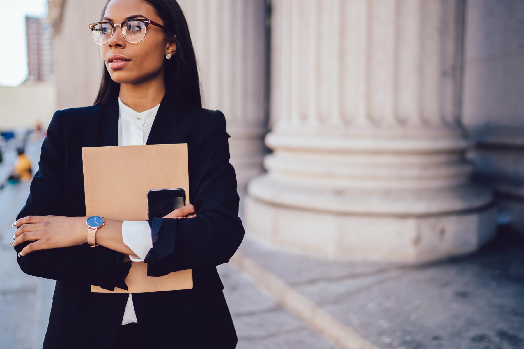 thoughtful-businesswoman-in-formal-wear-in-city