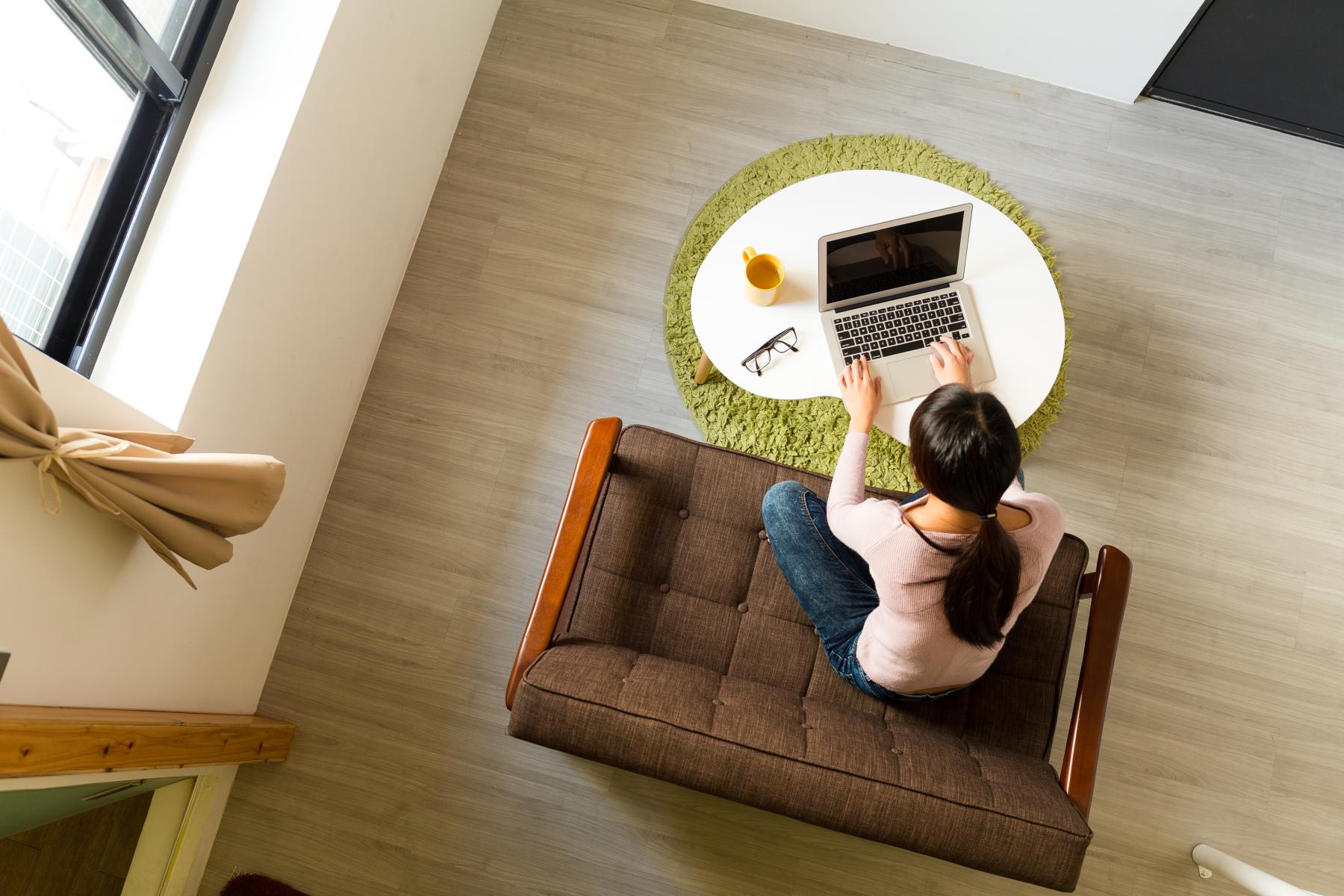 top down view of woman on a computer