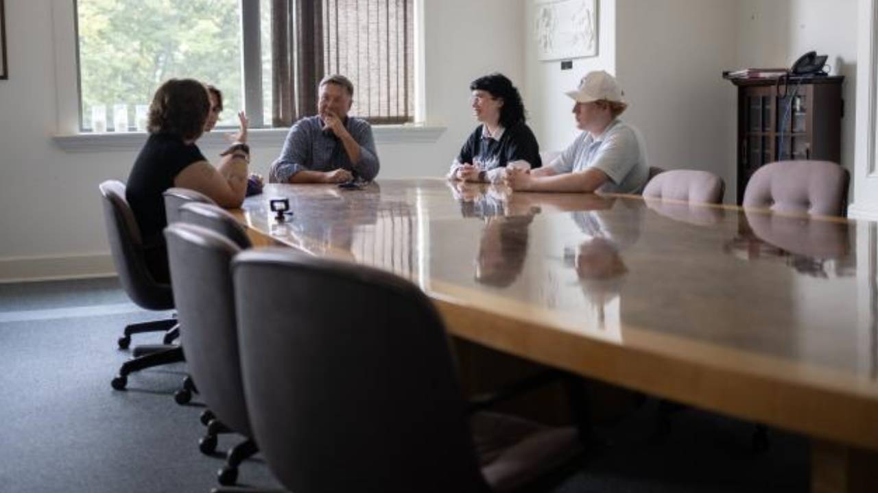 Debate Team talking to News